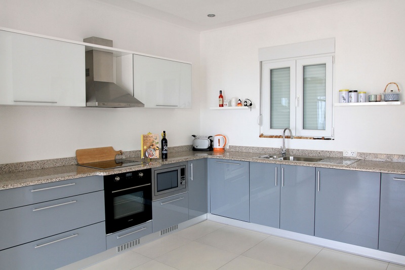 Open plan fully fitted kitchen, with dishwasher and microwave