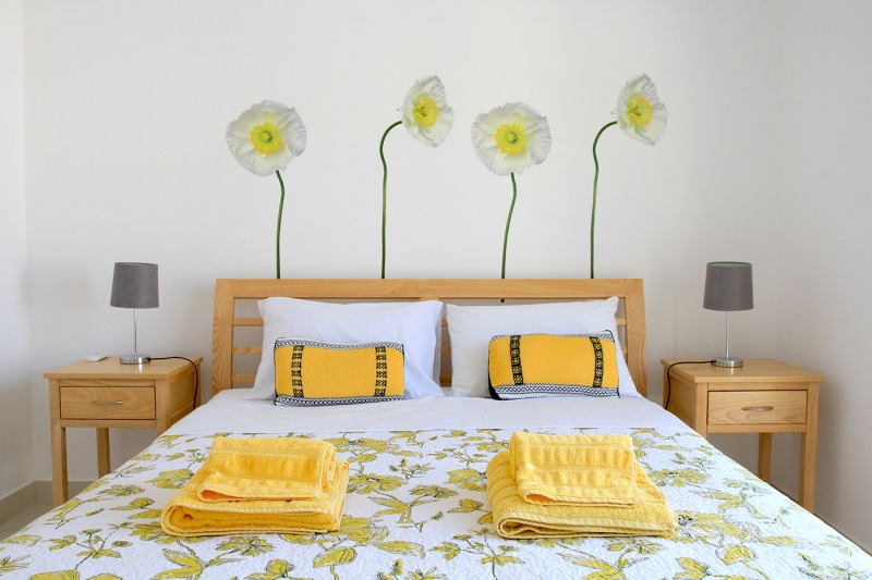 Luxury Villa Arc-Secondary master bedroom with sea view king-sized bed with quality cotton linen