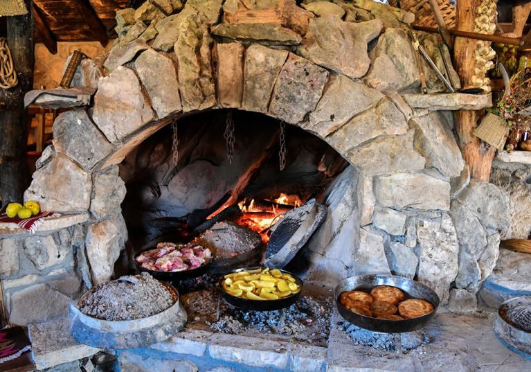 Warming to the soul is the smell of the food cooking in the clay pots nestled amongst the fire embers -Restaurants in Trebinje
